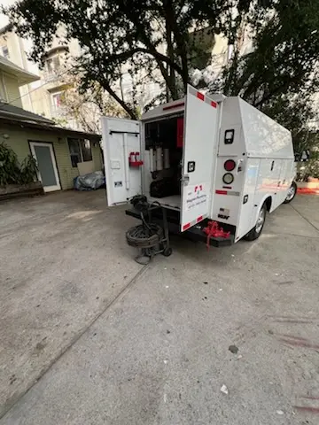 Magnet Plumbing service vehicle on-site for Grease Trap Cleaning in Maravilla Housing Project